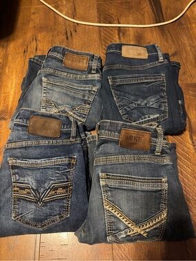 Lot of 4 Men’s Buckle Aiden Boot Jeans Size 28” 
USED Condition